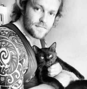 Photo of Ryan Kahlor and his rescued shelter cat taken by Hannah Kahlor.
